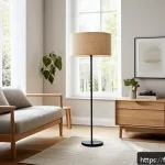 Home 18 스탠드 조명 추천 - A cozy living room scene featuring a tall floor lamp made of light oak wood with a smooth texture an...